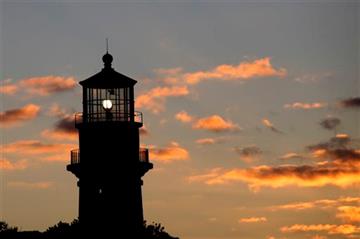 (AP Photo/Mark Lennihan, File). FILE - In this Oct. 13, 2013 file photo, Gay Head Light flashes a white signal in Aquinnah, Mass., on the island of Martha's Vineyard. The lighthouse flashes alternating red and white beams of light.